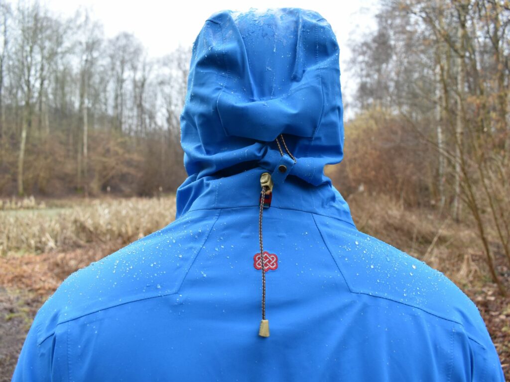 Helmet-compatible adjustable hood