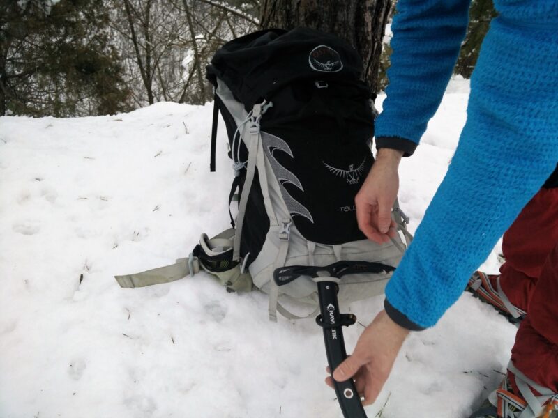 Position the ice axe so that the pick is facing inwards