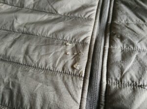 Synthetic jacket does not absorb the water droplets as fast a fleece