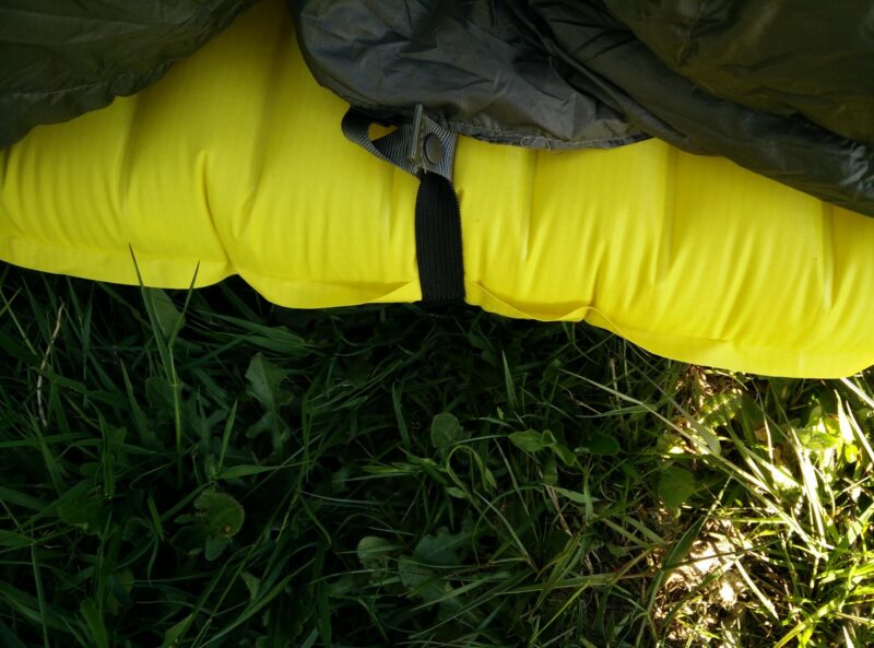 Kammok Firebelly Trail Quilt: Attached to the sleeping pad with snap fasteners
