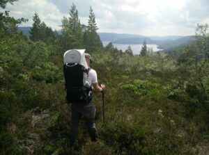 Carrying the Poco on a trail in Norway