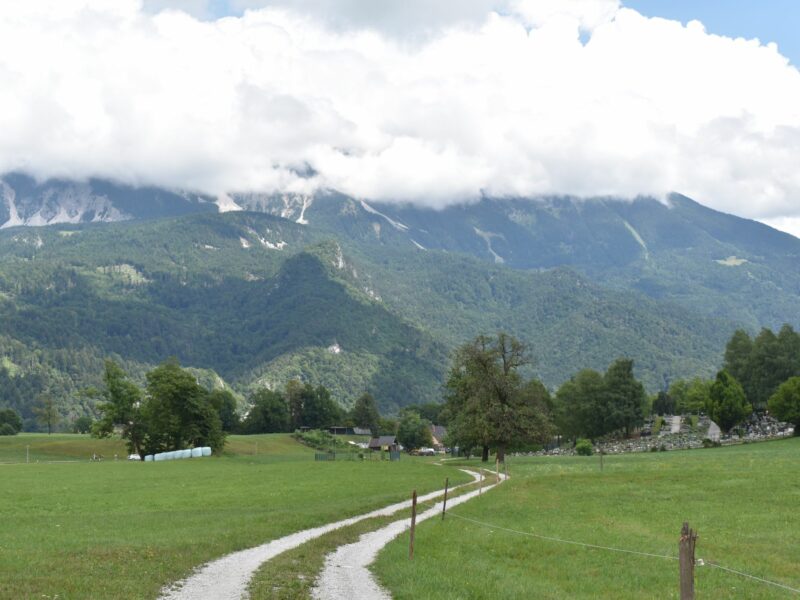Sum waterfall Hike - dirt road towards cemetery, looking at the Karawanke mountain range