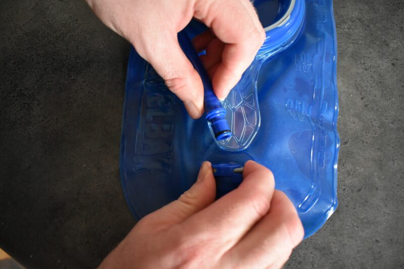 Detachable tube on a hydration bladder