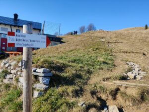 Matajur Hiking Trail - directions sign next to mountain hut