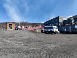 Mount Etna Hiking Trail - people queueing outside the terminal building to board a 4x4 bus
