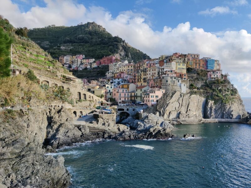Exploring and Hiking Cinque Terre - view on Manarola from the peninsula